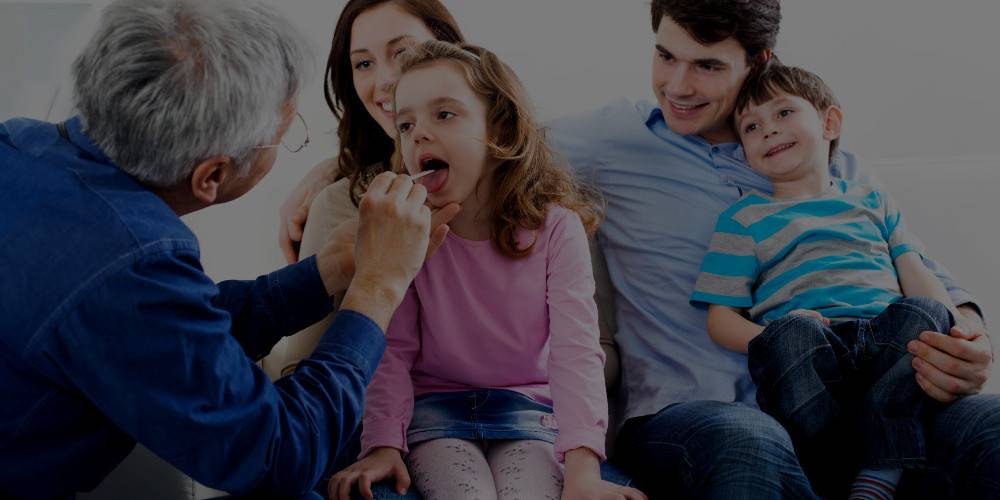 Family physician visiting a family at their home